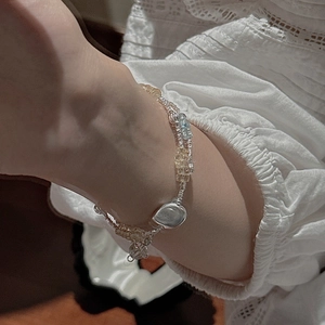 Retro S925 silver beaded bracelet with aquamarine and citrine stones on a female wrist