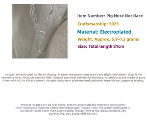 Detail of S925 silver double-layer sweater chain featuring chic pig-nose links and T-clasp