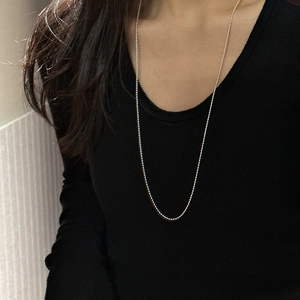 Minimalist S925 sterling silver beaded sweater necklace worn on black long sleeve top