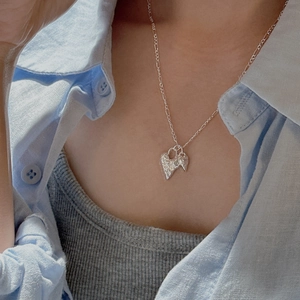 S925 sterling silver necklace with textured lava heart pendant on a Figaro chain