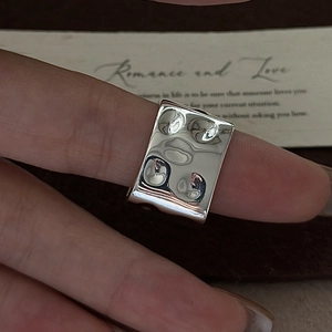 Minimalist S925 sterling silver square ring with hammered texture on dark leather