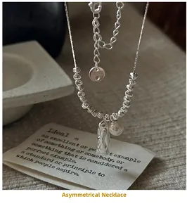 Detail of S925 silver necklace featuring a shell pearl and molten texture pendant