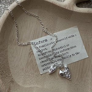 S925 sterling silver heart necklace with lava texture on a minimalist figaro chain