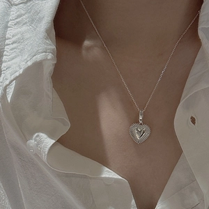 S925 sterling silver vintage heart pendant necklace with sunburst texture on white shirt
