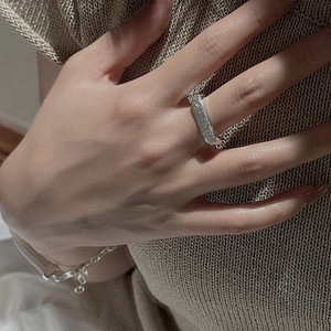 Minimalist S925 sterling silver ring with handmade texture shown on model finger