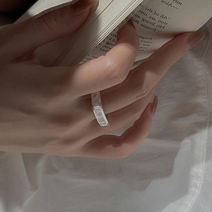 Minimalist S925 sterling silver ring with irregular hammered texture on model