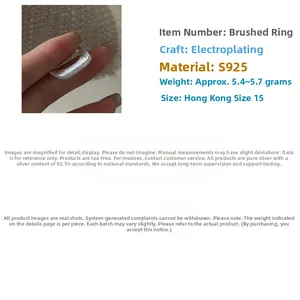 Detailed macro view of an S925 sterling silver square ring with brushed metal texture