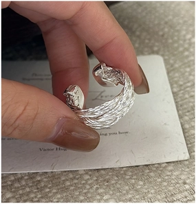 Close-up of S925 sterling silver ring showing the braided texture and S925 hallmark