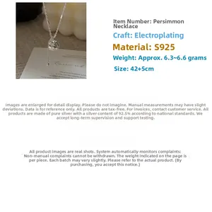 Detail of S925 sterling silver persimmon pendant necklace with dimensions on a gift card