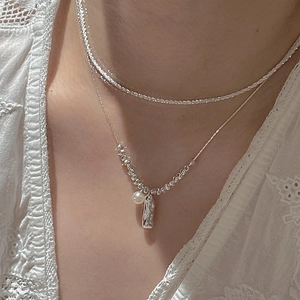 S925 sterling silver layered necklace featuring a white pearl and irregular metal pendant