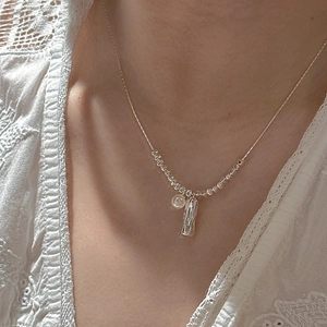 Minimalist S925 sterling silver necklace featuring small beads and pearl bar pendants