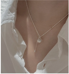 Close-up of S925 silver persimmon pendant necklace with bamboo chain on white shirt