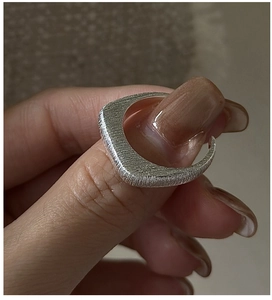 Detailed view of S925 sterling silver ring with brushed matte texture and geometric design