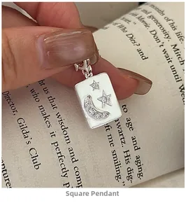 Detailed view of an S925 silver square pendant featuring moon and star zircon patterns