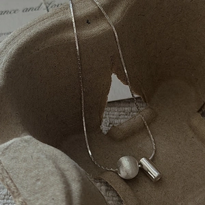 Minimalist S925 sterling silver necklace with matte brushed ball and polished bead pendant