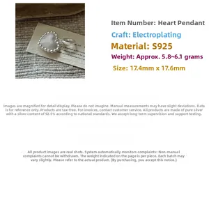 Detail view of a vintage textured S925 sterling silver heart pendant with beaded edges