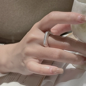 Modern S925 sterling silver textured ring with minimalist brushed finish on model hand