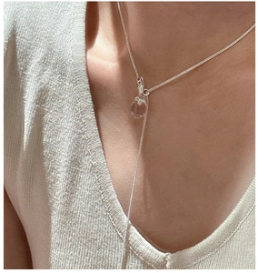 Detailed view of S925 sterling silver necklace with transparent crystal ball pendant