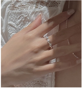 Close-up of S925 sterling silver beaded ring showing textured retro design on finger