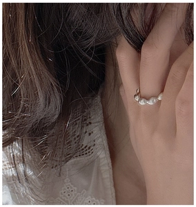 Detail of S925 sterling silver beaded ring on finger with elegant minimalist texture