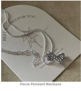 Detailed close-up of S925 sterling silver rocking horse pendant with delicate bead chain