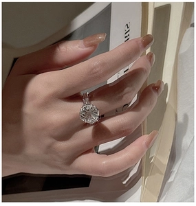 Macro detail of 925 silver ring featuring a large white crystal with fireworks cut finish