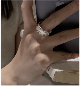 Detailed view of S925 sterling silver multilayer ring with woven vintage texture