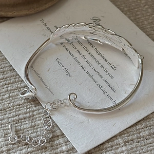 S925 sterling silver feather cuff bracelet with adjustable chain and lobster clasp