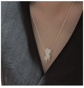 Detailed view of an S925 silver zebra pendant necklace on a black background