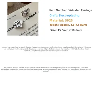 Detail view of S925 sterling silver earrings with textured abstract crumpled design