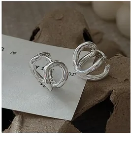 Detail of S925 sterling silver irregular double hoop earrings on a vintage card