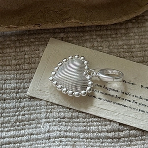 S925 sterling silver heart charm with vintage texture and beaded edges in matte finish