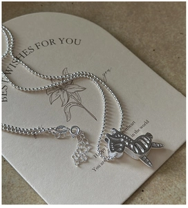 Macro shot of S925 sterling silver hallmark on the vintage horse pendant necklace