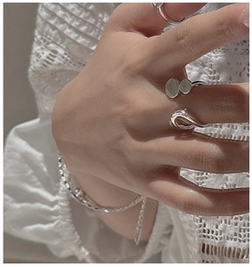 Detailed view of S925 sterling silver minimalist double-layer rings on a model's hand