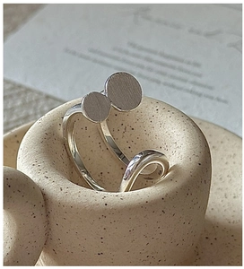 Detailed view of S925 sterling silver double disc ring with brushed and polished texture