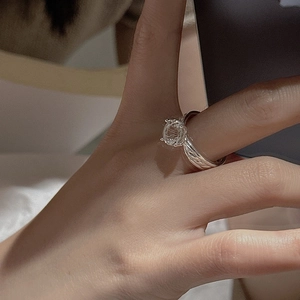 S925 sterling silver ring with woven band and large round white crystal on hand