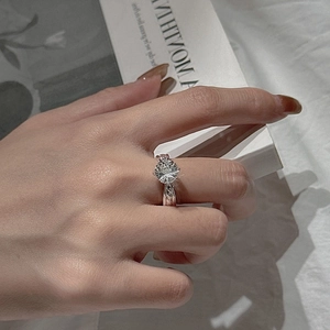 Elegant S925 silver ring with firework-cut white crystal and braided band texture