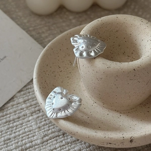 Minimalist S925 sterling silver heart earrings with textured edges and crystal center
