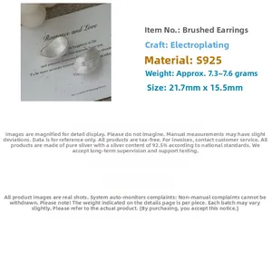 Detail of brushed S925 sterling silver earrings with electroplated metal texture
