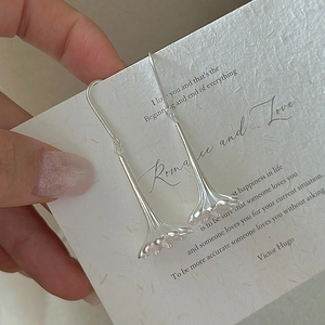 Elegant S925 sterling silver long drop earrings with minimalist floral bud pendants