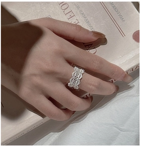 Detailed view of vintage S925 silver lace ring with intricate hollow floral patterns