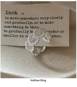 Detailed close-up of S925 sterling silver hollow lace texture ring with adjustable band