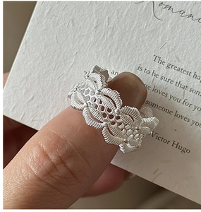 Macro shot of S925 sterling silver ring featuring intricate lace hollow and honeycomb texture