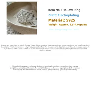 Detail showing S925 sterling silver ring with hollow lace texture and polished finish