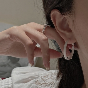 Minimalist matte S925 sterling silver earrings and silver beaded ring on model