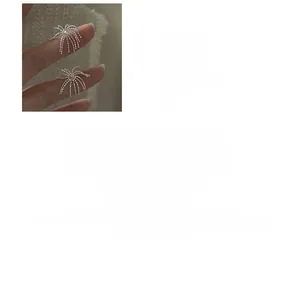 Detailed view of S925 sterling silver firework tassel earrings with fine cubic zirconia
