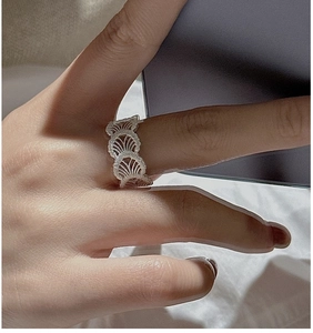 Macro detail of S925 sterling silver ring featuring intricate hollow lace texture