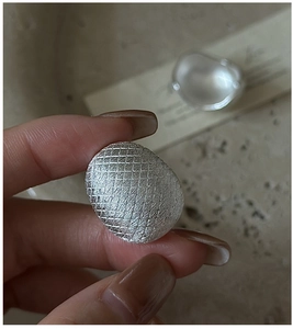Macro shot of S925 sterling silver ring with textured brushed finish and matte surface