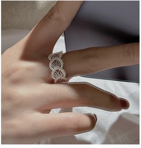 Detailed view of S925 sterling silver ring with delicate lace textured shell patterns