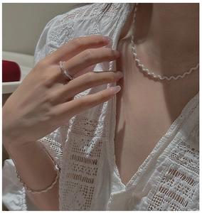 Detail of twisted rope texture on S925 sterling silver necklace, ring and bracelet set